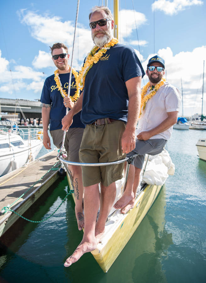 July 27, 2017 - (L-R) Navy Chief Petty Officer Brian Bugge, Chris Ryder and Beau Romero on their sailboat "Stay Gold" after sailing from Washington State to Pearl Harbor, Hawaii. Brian Bugge was promoted to Ensign Limited Duty Officer on August 1, 2017. (U.S. Navy photo by Mass Communication Specialist 1st Class Daniel Hinton)