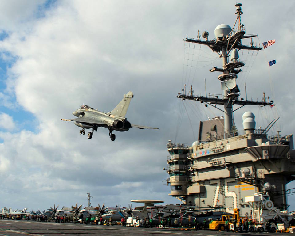 February 7, 2022 - A French Navy Rafale F3R flies over the flight deck of the Nimitz-class aircraft carrier USS Harry S. Truman (CVN 75). The Harry S. Truman Carrier Strike Group is on a scheduled deployment in the U.S. Sixth Fleet area of operations in support of naval operations to maintain maritime stability and security, and defend U.S., allied and partner interests in Europe and Africa. (U.S. Navy photo by Mass Communication Specialist 3rd Class Tate Cardinal)