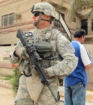 Army Staff Sgt. Peter Rosie with the 1st Infantry Division pulls security duty during his unit's deployment to Iraq in 2009. Rosie had served as a civilian paramedic with the New York City Fire Department during 9/11. Courtesy photo