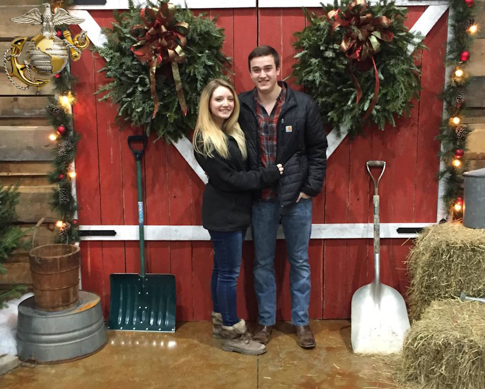 David and Brianna Whitehead in front of a barn at a Christmas market in Marietta, Georgia on December 23, 2020. (Image created by USA Patriotism! from photo provided by David and Brianna Whitehead.)