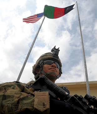 U.S. Army Spc. Jose Vallejo, an infantryman with the Focus Targeting Force of the 3rd Brigade Combat Team, 1st Infantry Division, Task Force Duke, poses outside his BCT headquarters on Forward Operating Base Salerno July 17, 2011. Vallejo, a Queens, N.Y., native cites the attacks of 9/11 and his resulting desire to help fight terrorism as major reasons behind his joining the military. Photo by Army Staff Sgt. Ben Navratil 