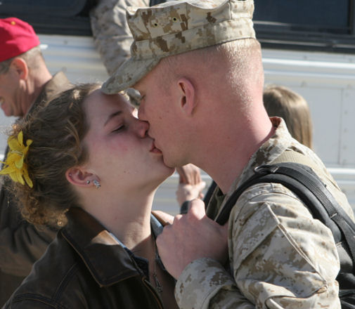 Lance Cpl. Andrew Zerbe, Kilo Company, 3rd Battalion, 4th Marine Regiment, and Alto, Mich., native kisses his wife, Anna Zerbe, Yucca Valley, Calif., native, one last time before stepping onto the bus during 3/4’s departure from the Combat Center Feb. 25, 2008. 3/4 will be deployed for seven months in western Al Anbar Province. 3/4 has deployed to Iraq five times in support in Operation Iraqi Freedom.